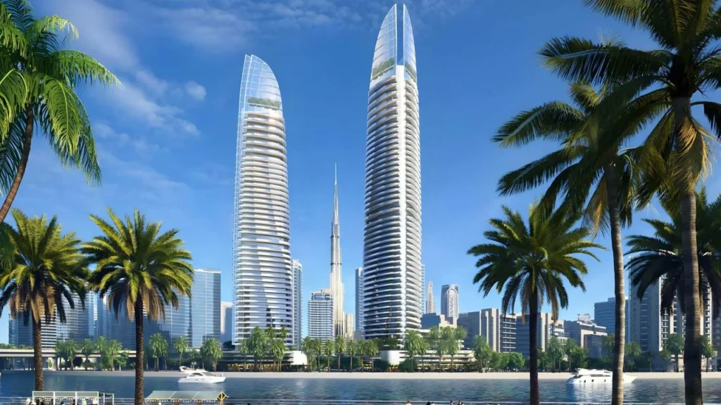 Two skyscrapers framed by palm trees, representing Dubai's booming real estate sector and a recent $67m sale in Business Bay